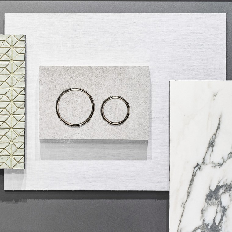 Die Geberit Sigma21 Betätigungsplatte in Betonoptik und verchromten Designringen