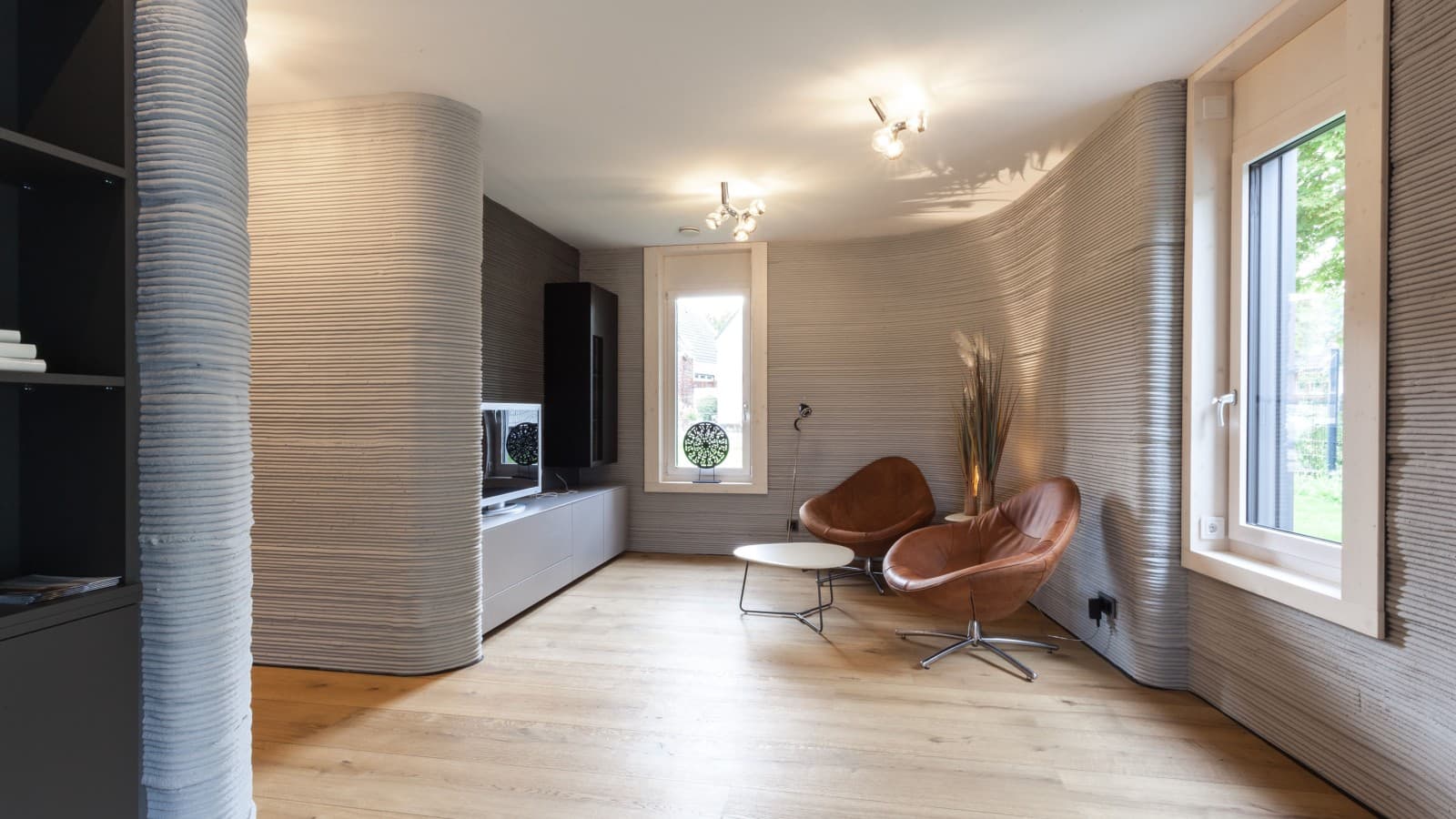Das Haus aus dem 3D-Drucker ist geprägt von Sichtbeton und einer minimalistischen Einrichtung Das Haus aus dem 3D-Drucker ist geprägt von Sichtbeton und einer minimalistischen Einrichtung